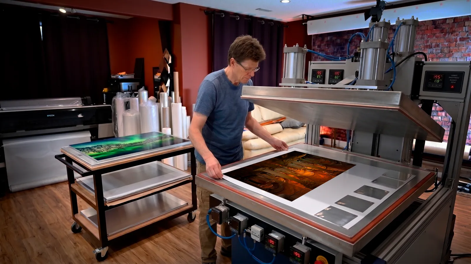 Alex Gubski making a dye sublimation print on a heat press in his studio