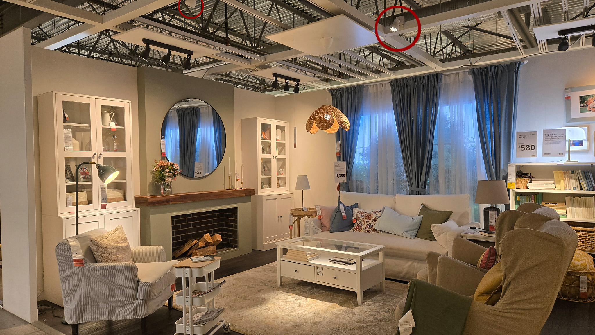 IKEA showroom vignette where accent lighting on the ceiling grid shapes the mood of the display